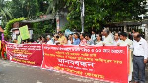 human chain protesting workers killed due to boiler blast and domestic workers tortured